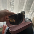 Солнцезащитные очки • Miu Miu • Черный